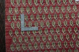 Backside of handmade 2000s Shiraz rug showing knot structure and weave density