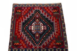 Surface texture of 2000s Shiraz rug with natural Wool and intricate pattern