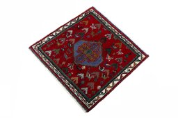 Corner detail of 2000s Shiraz rug showing border pattern and Wool pile