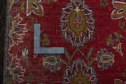 Backside of handmade 2000s Shiraz rug showing knot structure and weave density