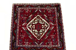Surface texture of 2000s Shiraz rug with natural Wool and intricate pattern