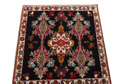 Surface texture of 2000s Shiraz rug with natural Wool and intricate pattern