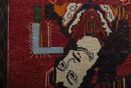Backside of handmade 2000s Shiraz rug showing knot structure and weave density