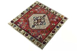 Corner detail of 2000s Shiraz rug showing border pattern and Wool pile