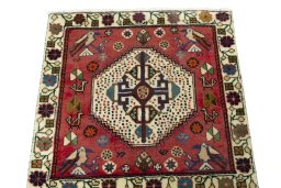Surface texture of 2000s Shiraz rug with natural Wool and intricate pattern