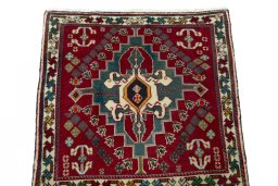 Surface texture of 2000s Shiraz rug with natural Wool and intricate pattern