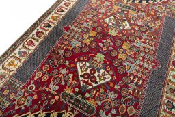 Backside of handmade 2000s Shiraz rug showing knot structure and weave density