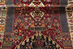 Full view of 2000s Shiraz rug from Iran / Persia, 280 × 173 cm in Red tones