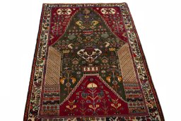 Surface texture of 2000s Shiraz rug with natural Wool and intricate pattern