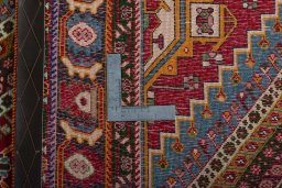 Surface texture of 2000s Shiraz rug with natural Wool and intricate pattern