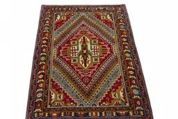 Surface texture of 2000s Shiraz rug with natural Wool and intricate pattern