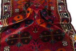 Corner detail of 2000s Shiraz rug showing border pattern and Wool pile