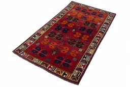 Corner detail of 2000s Shiraz rug showing border pattern and Wool pile
