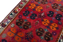 Backside of handmade 2000s Shiraz rug showing knot structure and weave density