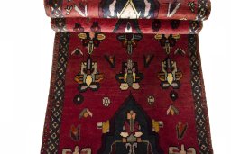 Full view of 2000s Shiraz rug from Iran / Persia, 328 × 64 cm in Red tones