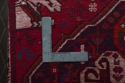 Backside of handmade 2000s Shiraz rug showing knot structure and weave density