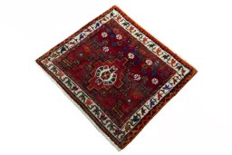 Corner detail of 2000s Shiraz rug showing border pattern and Wool pile