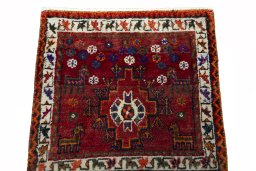 Surface texture of 2000s Shiraz rug with natural Wool and intricate pattern