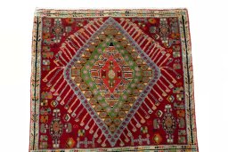 Surface texture of 2000s Shiraz rug with natural Wool and intricate pattern