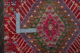 Backside of handmade 2000s Shiraz rug showing knot structure and weave density