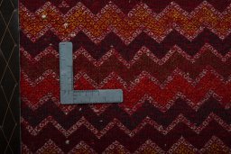 Backside of handmade 2000s Shiraz rug showing knot structure and weave density
