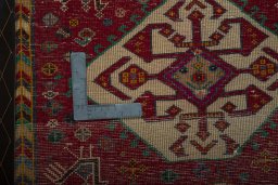Backside of handmade 2000s Shiraz rug showing knot structure and weave density
