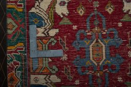 Backside of handmade 2000s Shiraz rug showing knot structure and weave density