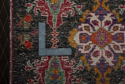 Backside of handmade 2000s Shiraz rug showing knot structure and weave density