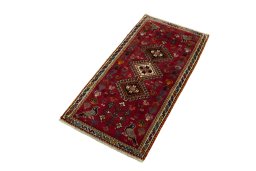 Corner detail of 2000s Shiraz rug showing border pattern and Wool pile