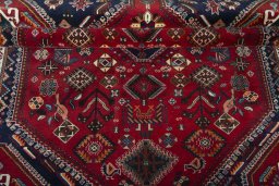 Corner detail of 2000s Shiraz rug showing border pattern and Wool pile