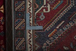 Surface texture of 2000s Shiraz rug with natural Wool and intricate pattern