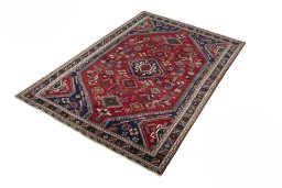 Corner detail of 2000s Shiraz rug showing border pattern and Wool pile