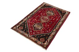 Corner detail of 2000s Shiraz rug showing border pattern and Wool pile
