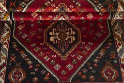 Full view of 2000s Shiraz rug from Iran / Persia, 174 × 110 cm in Red tones