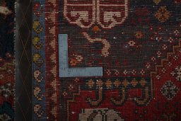Surface texture of 2000s Shiraz rug with natural Wool and intricate pattern