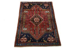 Surface texture of 2000s Shiraz rug with natural Wool and intricate pattern