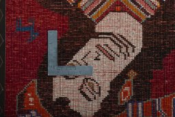 Backside of handmade 2000s Shiraz rug showing knot structure and weave density