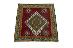 Surface texture of 2000s Shiraz rug with natural Wool and intricate pattern