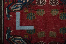 Backside of handmade 2000s Shiraz rug showing knot structure and weave density