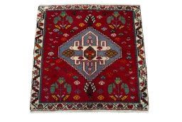 Surface texture of 2000s Shiraz rug with natural Wool and intricate pattern