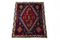 Surface texture of 2000s Shiraz rug with natural Wool and intricate pattern