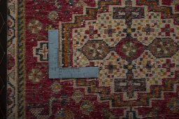 Backside of handmade 2000s Shiraz rug showing knot structure and weave density