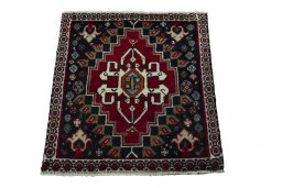 Surface texture of 2000s Shiraz rug with natural Wool and intricate pattern