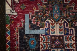 Backside of handmade 2000s Shiraz rug showing knot structure and weave density
