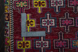 Backside of handmade 2000s Shiraz rug showing knot structure and weave density