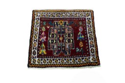 Surface texture of 2000s Shiraz rug with natural Wool and intricate pattern