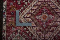 Backside of handmade 2000s Shiraz rug showing knot structure and weave density