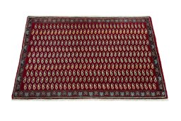 Surface texture of 2000s Shiraz rug with natural Wool and intricate pattern