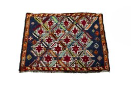 Surface texture of 2000s Shiraz rug with natural Wool and intricate pattern
