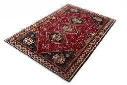 Corner detail of 2000s Shiraz rug showing border pattern and Wool pile
